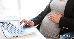 Pregnant woman in office