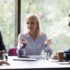 Older businesswoman talking with younger managers