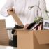 Resigning employee packing up desk