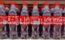 Coca Cola bottles on store shelf