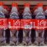 Coca Cola bottles on store shelf