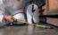 Pest control technician spraying area